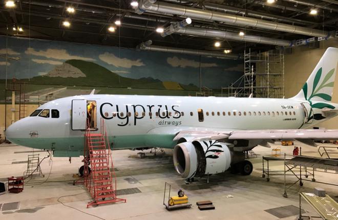 Самолет Airbus A319 в обновленной ливрее авиакомпании Cyprus Airways в покрасочном ангаре